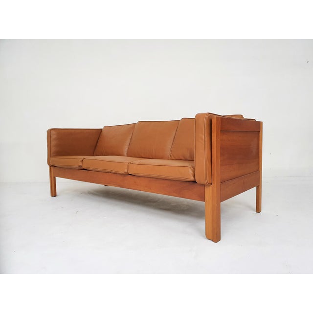 Wooden sofa with cognac leather cushions. Designed by Borge Mogensen for Fredericia. with new cognac leather cushion...
