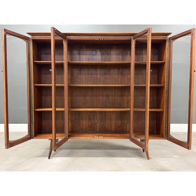 A mid century modern walnut bookcase made by Lane Furniture. Dated 1964. Excellent condition. 58.5” wide. 13.5” deep....