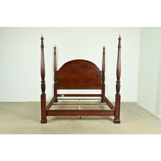 A gorgeous Georgian or Chippendale style carved cherry wood four-poster king size bed By Henredon USA, Late 20th Century...