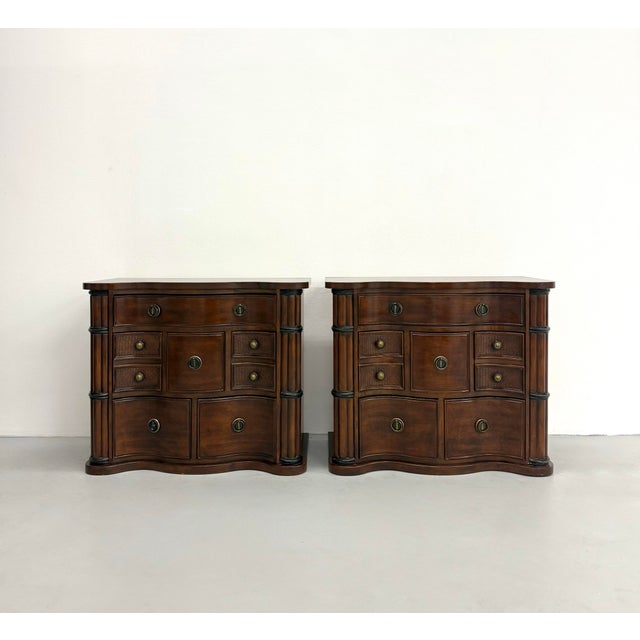 A handsome pair of vintage Neoclassical-inspired bachelor’s chests crafted in a warm walnut-toned finish. Each chest...