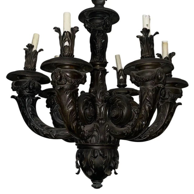 A magnificent pair of late 19th-century French neoclassical bronze chandeliers, each exceptionally cast and richly...
