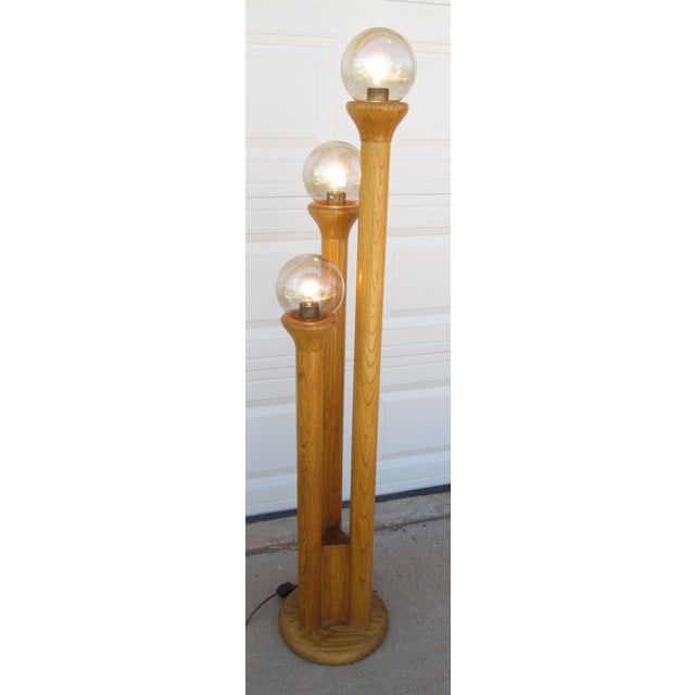 Mid Century Modern Honey Oak floor lamp designed by Charles Gibilterra for Modeline of California. The lamp is constructed...