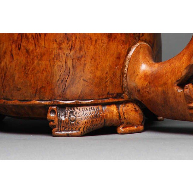 A fine and important Norwegian tankard in birch burl wood with carved lion motif on top of lid, thumb piece and feet....