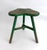 This rustic elm handcrafted stool has remnants of green paint and age earned patina. Three-legged with mortar and tenon...