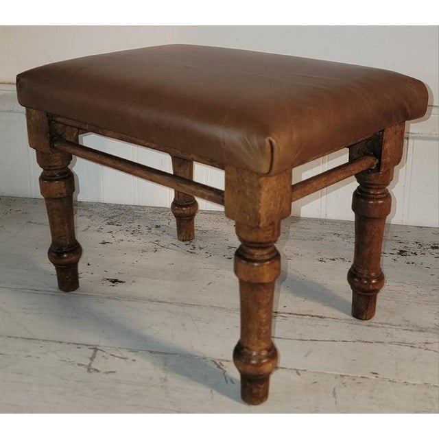 19Thc Hand carved foot stool with newly upholstered leather top.This beauty is in amazing condition and sturdy too.The...