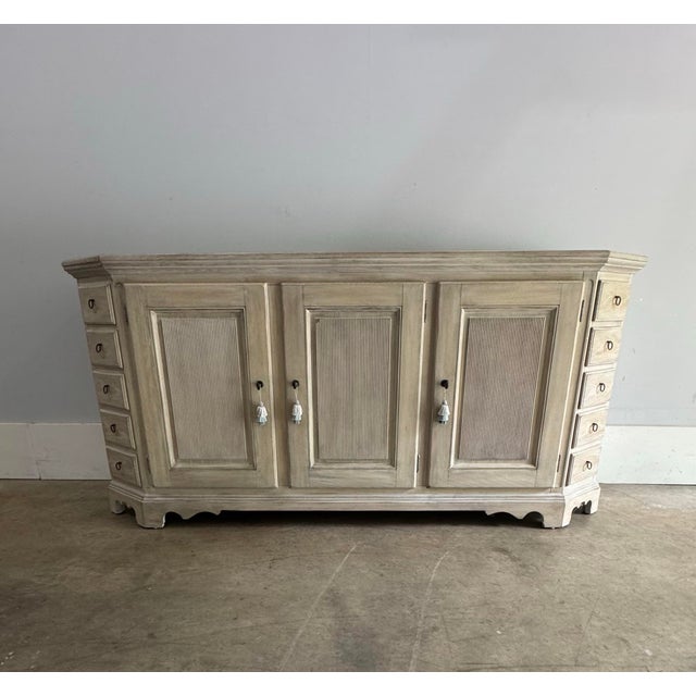 Handsome and refined, the Nimbostratus sideboard sports a unique clipped corner design with thirteen hand-crafted drawers....