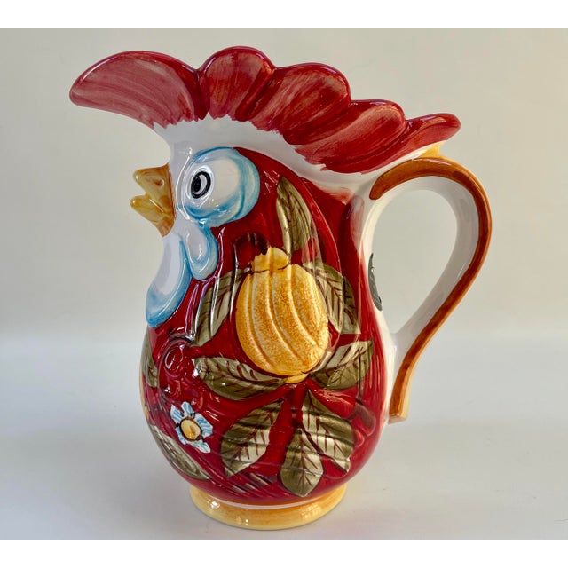 Large Italian ceramic rooster pitcher or vase from Deruta, Italy, a town famous for its ceramic artistry. The pitcher is...