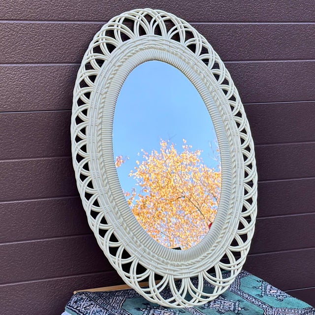 This fabulous oval mirror looks amazingly like the real deal - woven rattan and bamboo - however is made from injection...