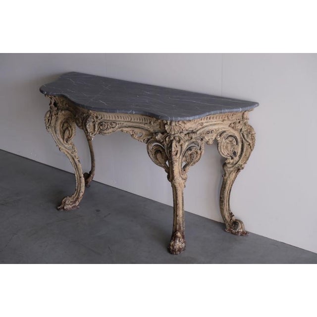 A rare Louis XV Revival cast iron console table, with original bronzed finish & marble, made and designed by the...
