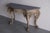 A rare Louis XV Revival cast iron console table, with original bronzed finish & marble, made and designed by the...