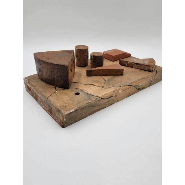 This antique 19th century English and Continental wooden cheese display board is a unique and one-of-a-kind piece for any...