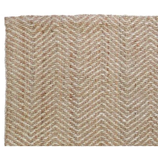 Our handwoven zig-zag jute rug in natural and bleach reflects a classic pattern and the remarkable craftsmanship of master...
