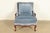 An outstanding French Louis XV style carved walnut bergère chair or lounge chair with ottoman In the manner of Baker...