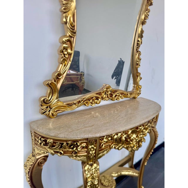 Make a breathtaking statement in your home with this magnificent French Rococo console and mirror set, masterfully...