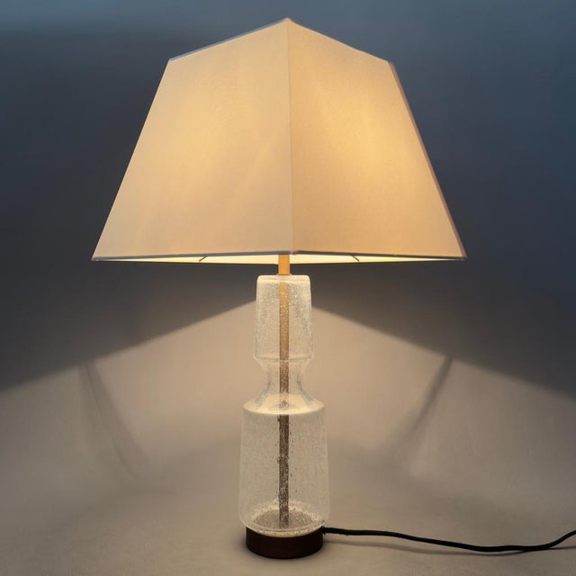 An elegant and refined lighting solution with a simple and sophisticated design. This rare and valuable table lamp by G...