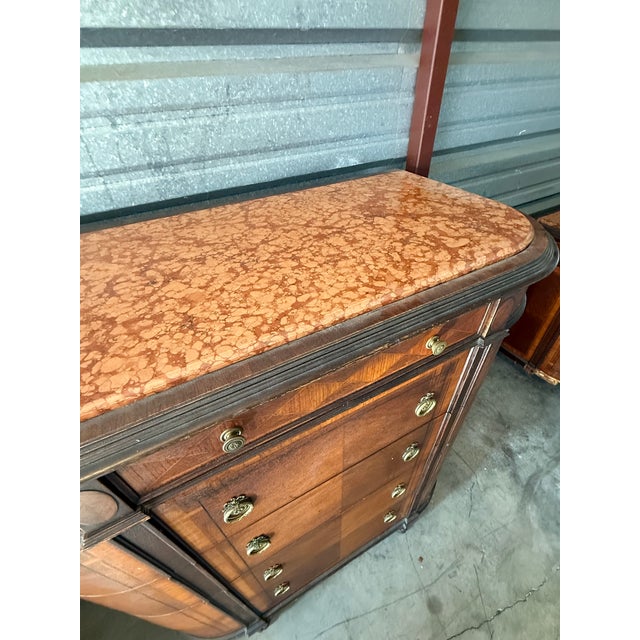 Elegant late 19th/early 20th-century French Louis XV Revival commode featuring a sculptural bombe silhouette, serpentine...