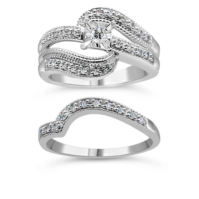 Surprise your beautiful bride with stunning natural diamonds! This 1/3 cttw round diamond engagement ring is an elegant...