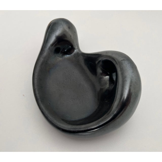 1960s freeform biomorphic sculptural accent dish in the style of French modernist ceramics creator Geoges Jouve. Finished...