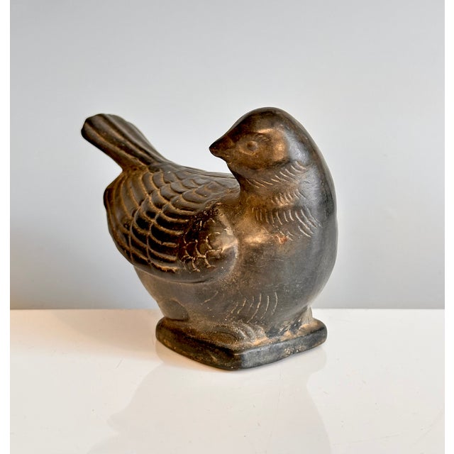 A beautifully detailed bird figurine in metal from South America. The fine piece is filled with concrete and is suitable...
