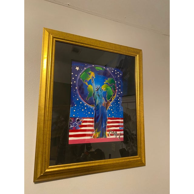 Peace On Earth by Peter Max. The lithograph is 18x24- The frame is 34x40. Limited edition with signed in the bottom right...