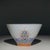 A charming Chinese porcelain tea cup. The exterior is finely hand-painted in vibrant Famille Rose enamels with a "Hai Shui...
