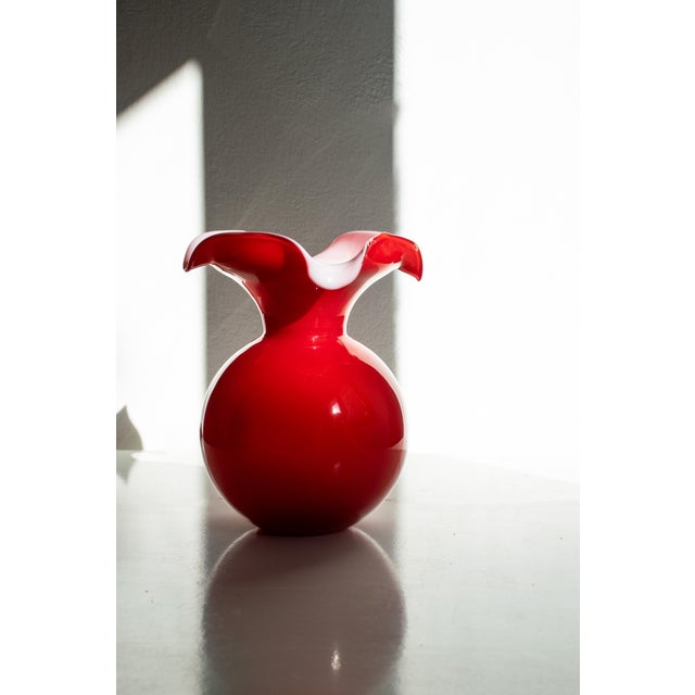 A beautiful pair of open vases, handcrafted by Venetian masters. The colors are original to the Murano tradition, in this...