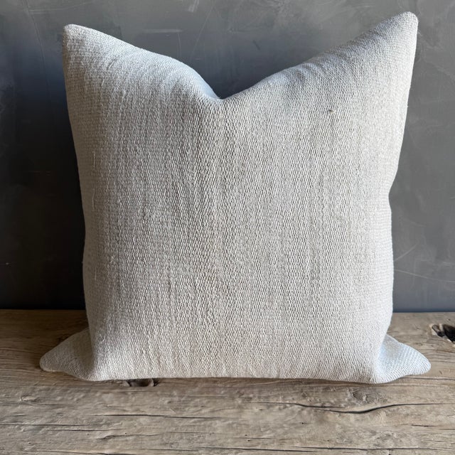 Creamy white hemp rug pillow with stripes. Soft hand, linen blend backing with zipper closure. Spot cleaning is...