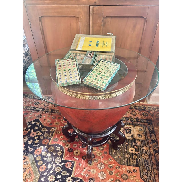 An exceptional vintage Chinese export Mah Jong set featuring genuine bone and bamboo tiles housed in its original silk...