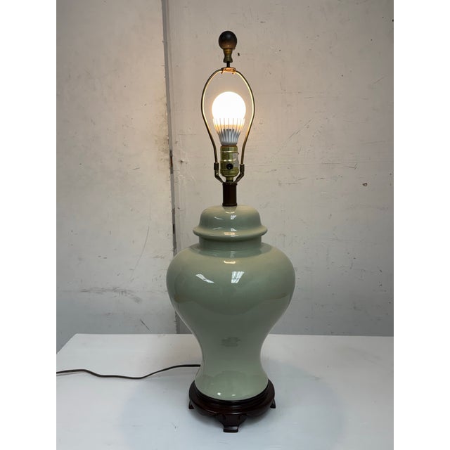 Design Plus Gallery presents a Chinese Ginger Jar Celadon Ceramic Table Lamp. The glazed ceramic body displays the classic...