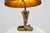 Striking and highly decorative Hollywood Regency table lamp from France, dating to the 1970s. The lamp features an...