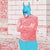Batman Says depicts a kneeling figure wearing a Batman mask, partially submerged in water outside a modern building. A...