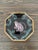 Boho chic safari inspired plates with angled bamboo edges. Understated green fauna motif throughout each design for a...