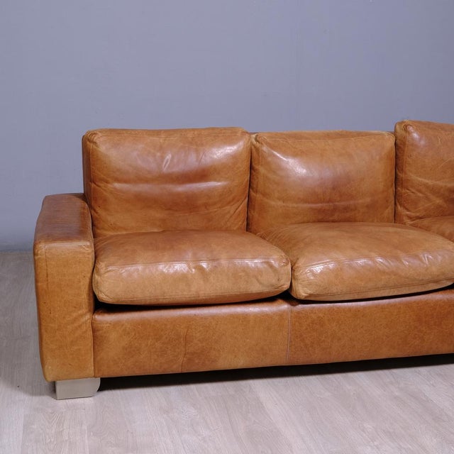 Beautiful and original three-seater sofa, in leather, artisan production, cushions with removable covers. Dimensions:...