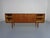 Skovmand & Andersen teak sideboard from the 1950s. Two sliding doors. Right & left with a shelf. In the middle with 5...