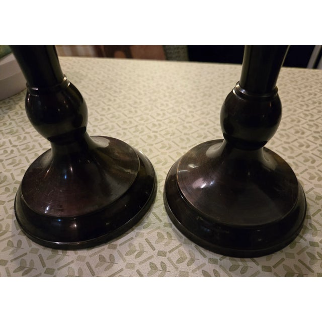 Nice pair of weighted candlesticks with a high gloss bronze finish. These have protective felt bottoms. EACH CANDLESTICK...