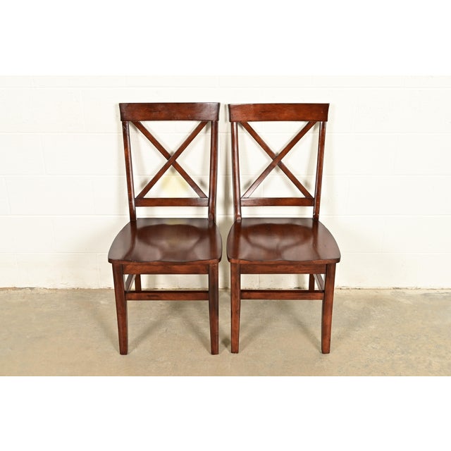 A gorgeous pair of English Country or Farmhouse style walnut X-back side chairs or dining chairs Circa Late 20th Century...