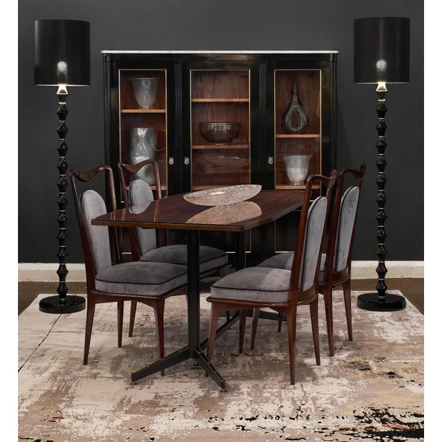 Fabulous pair of Murano glass floor lamps by A Dona. This modernist pair features hand-blown black glass. The polyhedral...