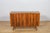 The small sideboard was designed by Bohumil Landsman and Hubert Nepozitek in the 1960s. It was manufactured by the Jitona...