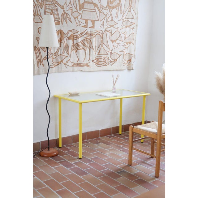 Desk designed by Giandomenico Belotti and produced by Fly Line, Italy, 1970s. A tubular frame in bright yellow lacquered...