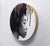 This artwork features a striking profile of a figure, rendered in charcoal and pastel, showcasing rich textures and...
