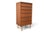 This narrow highboy dresser was made by Austinsuite in England during the 1960s. The case combines teak and rosewood,...
