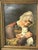 An elegant antique European portrait painting depicting a young woman seated with a beautiful white cat resting in her...