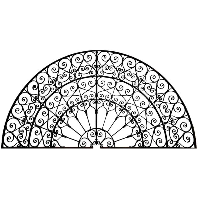 Antique, large two-part wrought iron skylight grill. Two semi circles makeup this very large, round grill featuring...