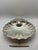 A beautifully sculpted vintage silver-plated serving tray featuring three charming fish-form feet and elegant radiating...