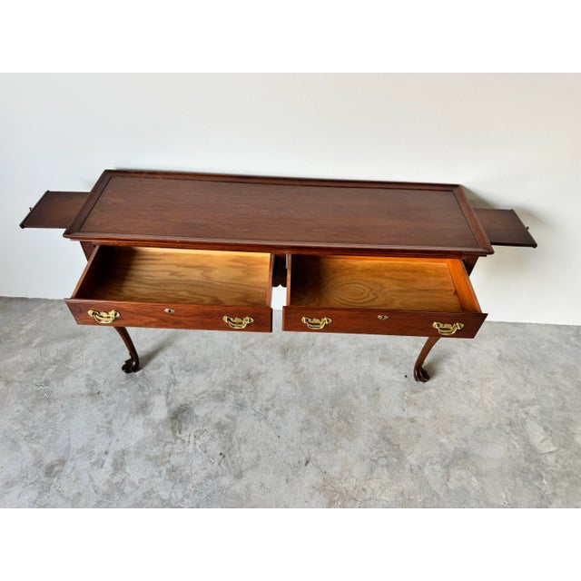 A timeless piece of American craftsmanship, this vintage solid cherrywood console table is part of the prestigious Trutype...