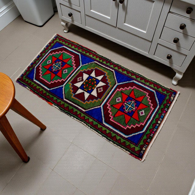 Vintage Turkish small rug from Konya, Central Anatolia, 1970, featuring warm red and green tones and authentic village...