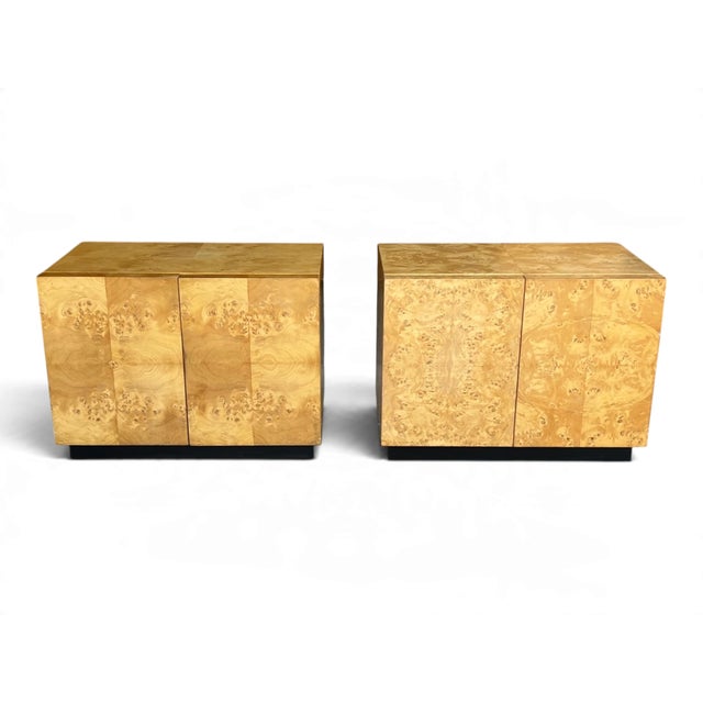 This pair of circa 1970s burl wood nightstands, in the manner of Milo Baughman, combines striking natural grain with a...