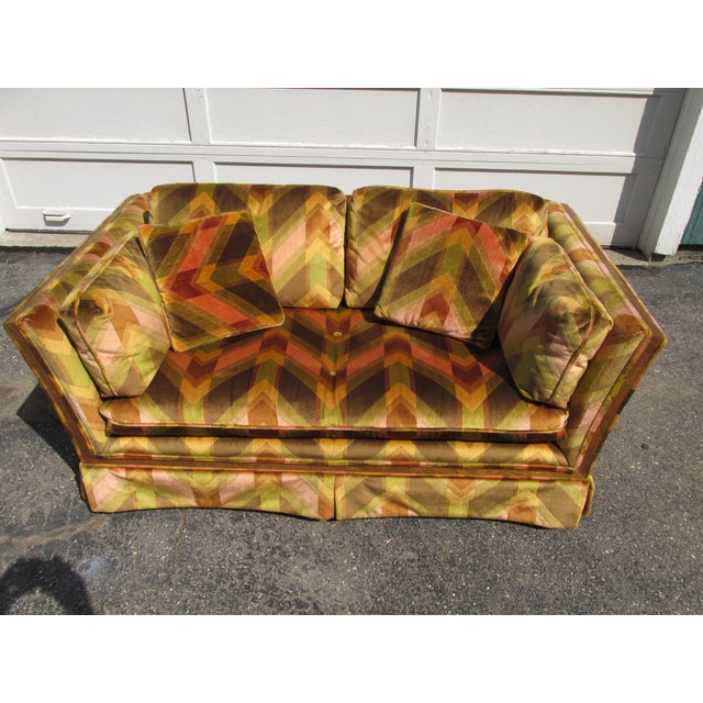 Vintage loveseat in the style of Milo Baughman / Thayer Coggin, circa 1970. Features colorful, bold geometric chevron...