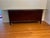 Offering a Mahogany Sideboard from the Barbara Barry Collection for Baker Furniture. Finished in a dark mahogany, the...