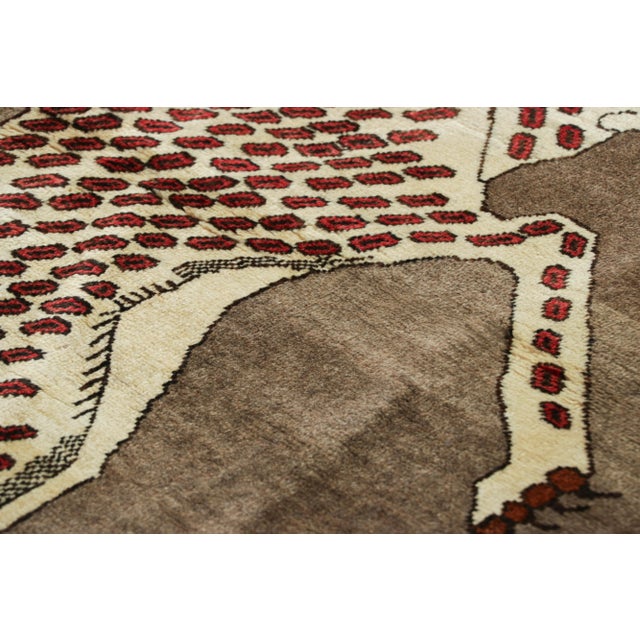 This vintage 3x5 Persian Gabbeh rug is the latest grand entry to Rug & Kilim’s curation of rare tribal pieces. Hand-...